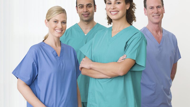 Diverse team of smiling healthcare professionals posing confidently
